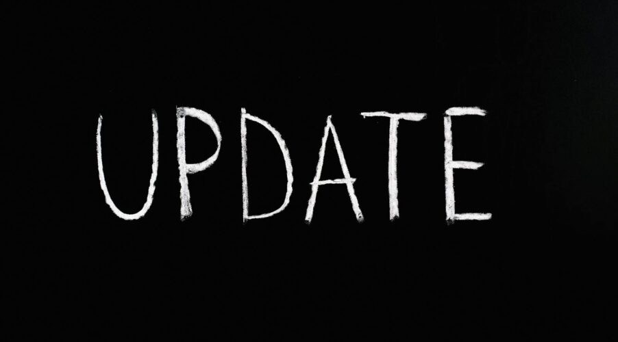 Bold 'UPDATE' text written in chalk on a blackboard. Perfect for concepts of change and communication.